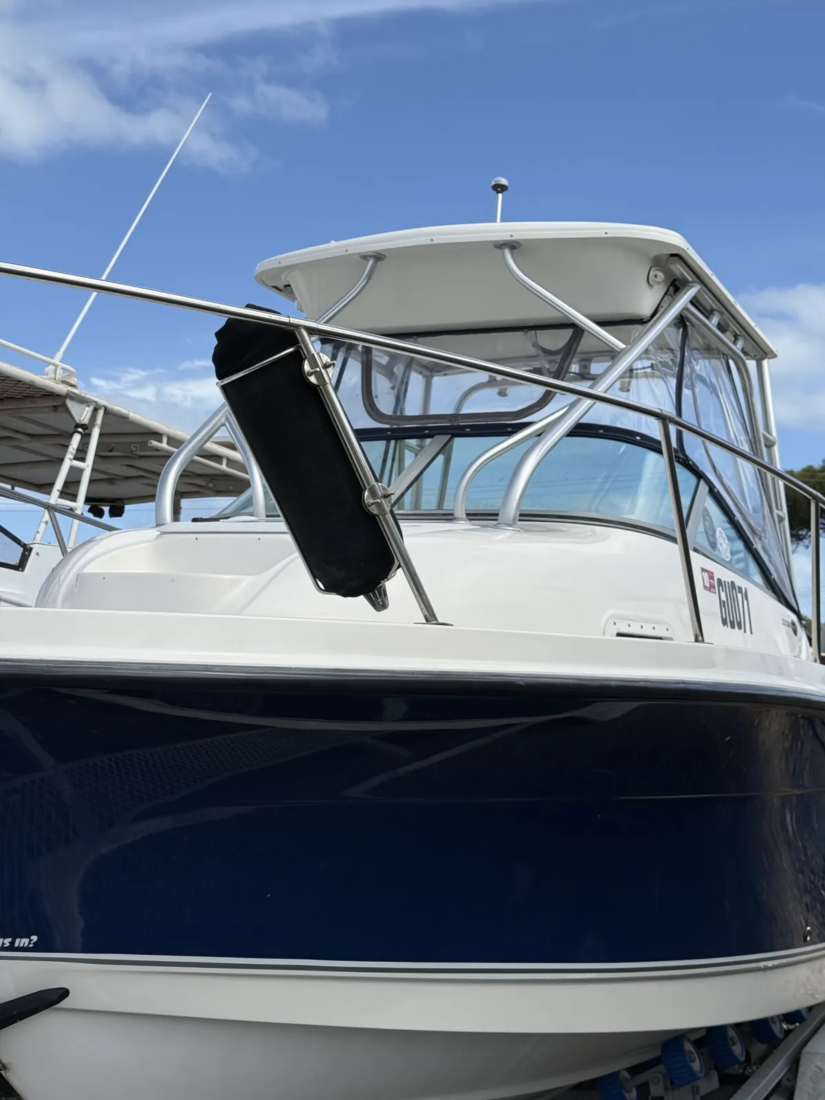 Foam on Wheels boat detailing Perth WA result — Trophy Pro bow with polished navy hull and stainless rails